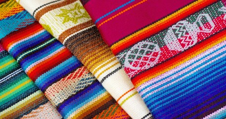 Colorful market with beautiful and unique handicraft fabric patterns available in Ecuador