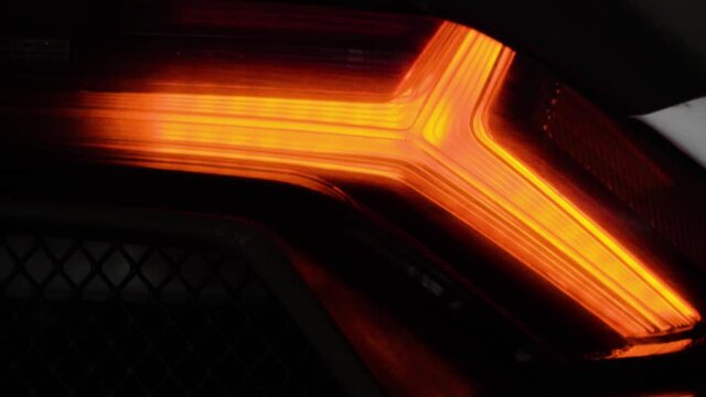 Tail led light detail of modern super sport fast car in 4K