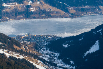 Top view of the snowy town and lake Zell am See in Austria.