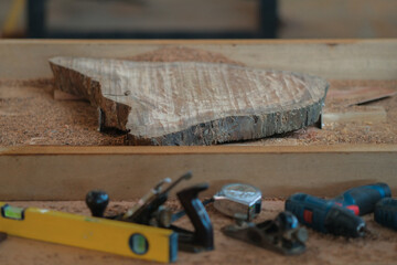Hand tools and power tool with  slab coffee table. Woodworking and carpentry production .Furniture...