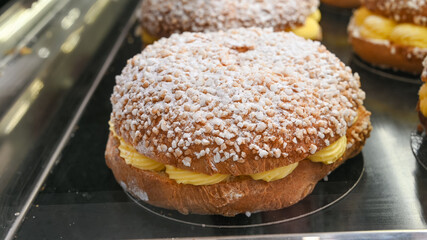French fresh baked sweet filled brioche pastry tarte tropezienne in confectionery shop in Saint-Tropez, Provence, France