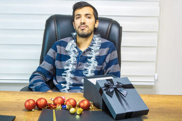 A person celebrating New Year alone, a businessman celebrating New Year alone, a person celebrating the new year.