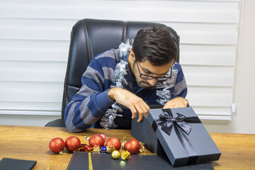 A person celebrating New Year alone, a businessman celebrating New Year alone, a person celebrating the new year.
