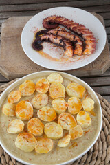 fresh octopus with potatoes in red paprika as diet food