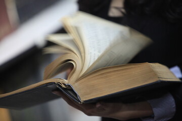 book with hand
