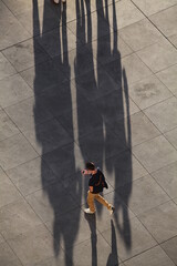 people shadow walking in the city