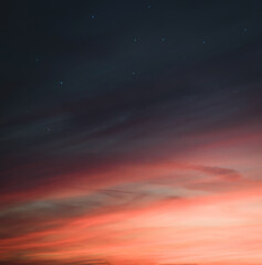 Obraz na płótnie Canvas Magical sunset sky with orange clouds