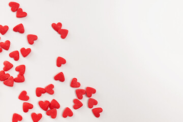 Sugar heart shaped sprinkles on white background