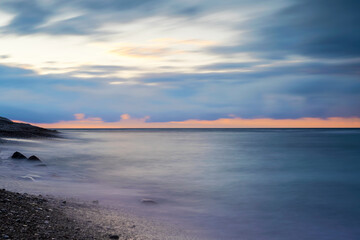 Fototapeta premium Cloudy winter sunset over the Baltic Sea at island of Gotland, Sweden