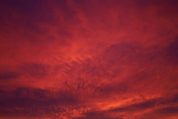 Fototapeta na wymiar red clouds in the first rays of the rising sun