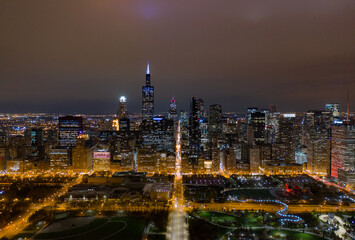 Fototapeta premium epic aerial drone shot of cityscape panorama at night time