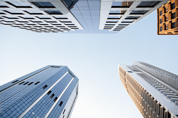 Obraz na płótnie Canvas Bottom view of modern office buildings, in the central business district of Sydney city, Australia.