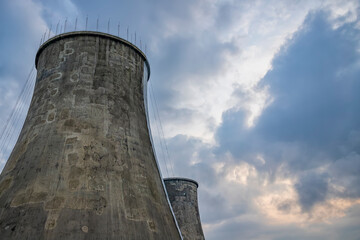 incredibly huge, industrial chimney made of concrete blocks. Concept of preserving the environment and taking care of nature