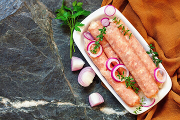 Kupaty - raw shashlik sausage of pork barbecue, grill. Raw sausage for grill.  Picnic. Top view