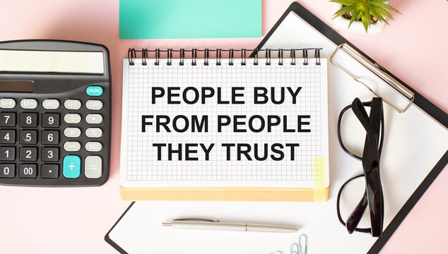 People Buy from People They Trust written on notebook page, red pencil on the right. Motivational Concept image