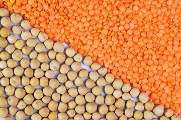 Lentils and chickpeas. The frame is divided in half, half covered with lentils and half with chickpeas