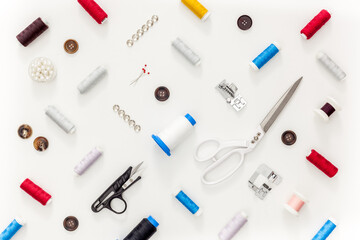 Sewing accessories and sewing supplies. Spools of thread, scissors and centimeter