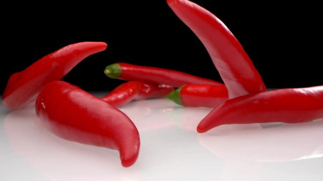 extreme close-up. detailed. hot red pepper on a dark background.
