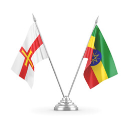 Ethiopia and Guernsey table flags isolated on white 3D rendering