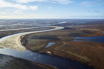 Aerial view and top view of the river in the tundra on the Taimyr Peninsula in Russia. Beautiful natural background