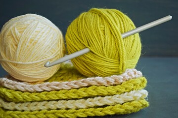 Wool yarn for knitting on a gray background.A hobby.