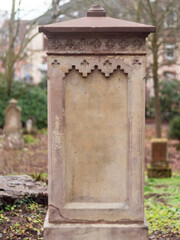 Fototapeta na wymiar Very old tombstone in the German cemetery in Europe.
