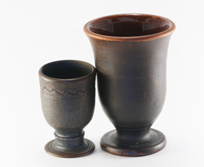 Two ceramic cups: large for wine, small for spirits (for example, tinctures), isolated on a white background. Pottery of the Vladimir and Kostroma regions.