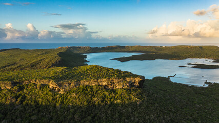 Aerial view above scenery of Curacao, Caribbean with ocean, coast, hills 