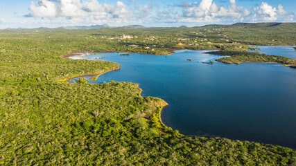 Aerial view above scenery of Curacao, Caribbean with ocean, coast, hills 