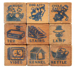 Worn and tattered vintage toy vocabulary word blocks.