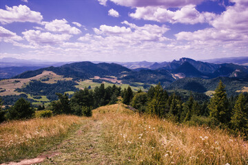 Fototapeta na wymiar Bielsko Biala, South Poland: Wide angle view of Polish mountains from south in summer against dramatic clouds. Beskidy mountains in Silesia near slovakia border.