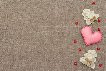 Valentine's Day concept with red felt heart and crochet fir trees