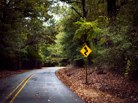 Curve In Road And Sign