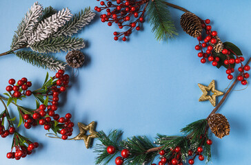 Fototapeta na wymiar Festive Christmas and new year decorations on blue background