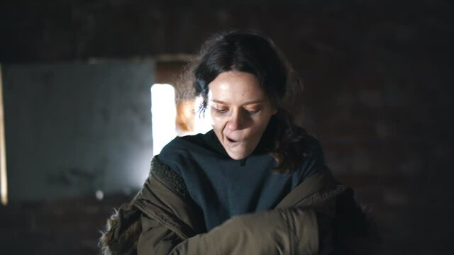 Drug addicted woman with withdrawal symptoms walking in abandoned place