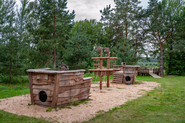 Empty playground in the form of a ship in nature. Abstract wooden ship.