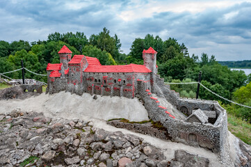 Historical scale toy model of Dinaburga castle on a coast of the Daugava River. Daugavas loki nature park, Latgale, Latvia. - obrazy, fototapety, plakaty