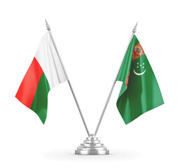 Turkmenistan and Madagascar table flags isolated on white 3D rendering