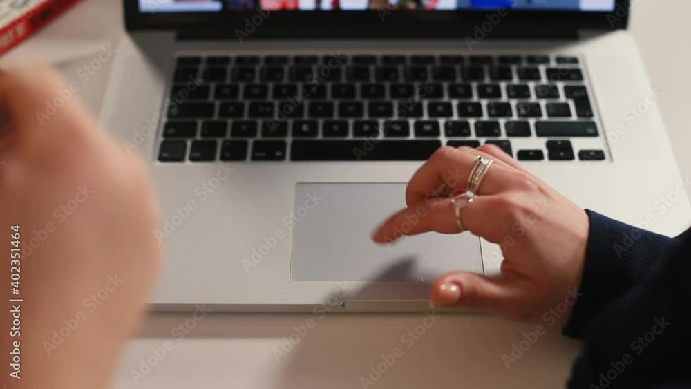 Poster the hands of freelancers use the laptop's touchpad. she makes a choice with finger, presses. search 