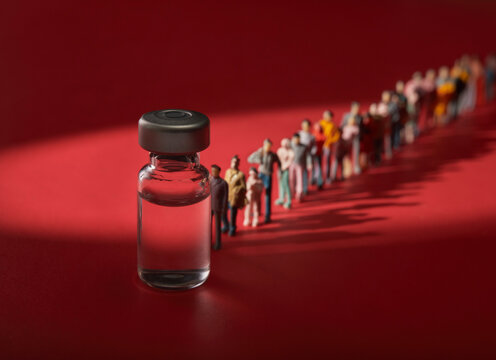 People Waiting In Line For Covid 19 Vaccine Vaccination Conceptual Still Life With Miniature People And Medicine Vial   Shadows Of People Shows Diversity In Age And Race.