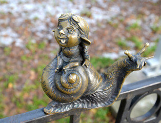 KALININGRAD, RUSSIA - DECEMBER 27, 2020: The figure of a hamlin girl sitting on a snail