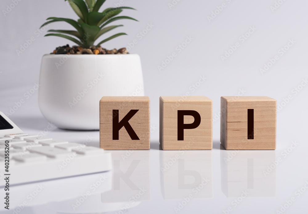 Poster kpi word on cubes. key performance indicator