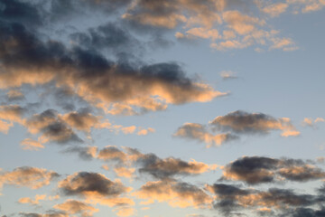 Naklejka na ściany i meble Dark clouds in the sky at sunset