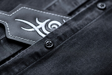 Close up of dark Men's shirt.