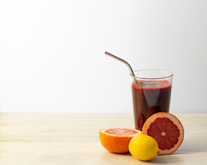 A fresh glass of juiced fruits and vegetables with copy space.