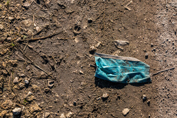 Medical mask against corona just thrown away