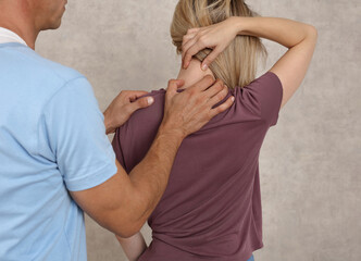 Woman suffering from neck and low back pain during medical exam. Chiropractic, , Physiotherapy....