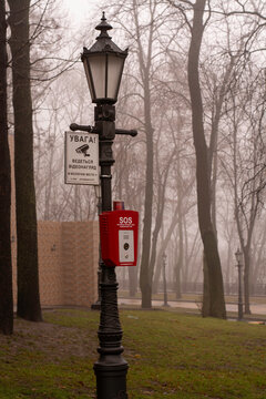 streetlight in city park with button SOS for emergency