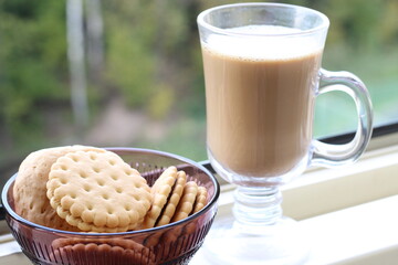 cup of coffee with cookies