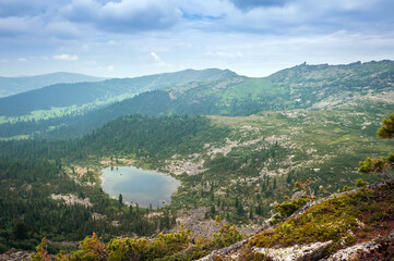 Fototapeta premium Taiga. Siberia. Morning mountain landscape on the lake.